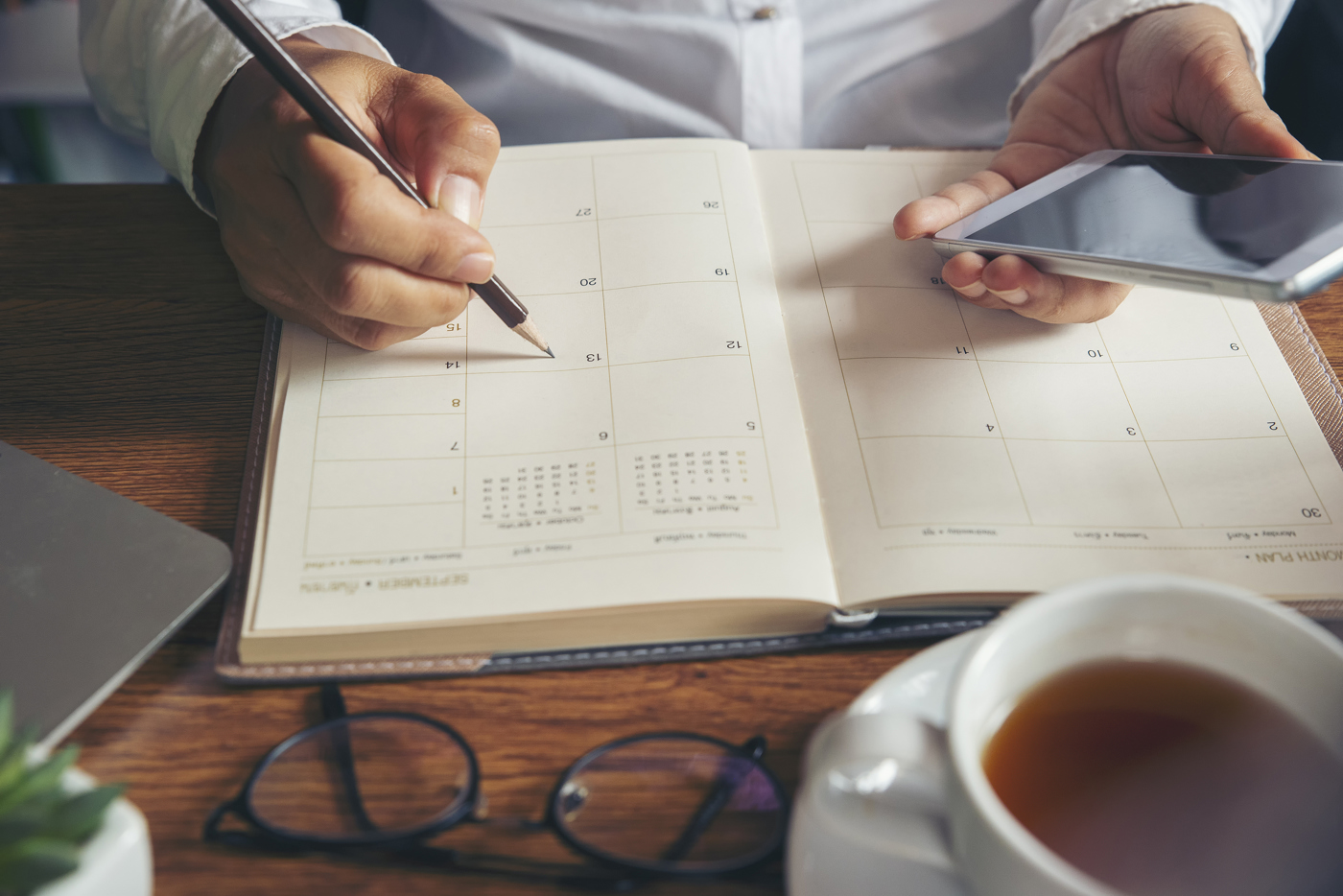 Man writing on calendar