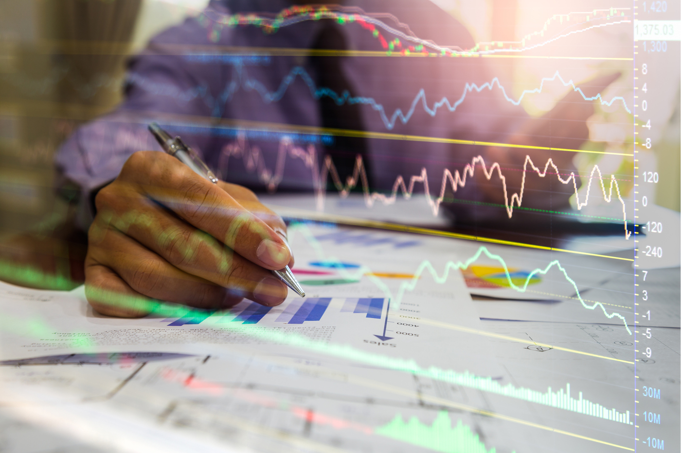 Investors do research in stock charts and tables