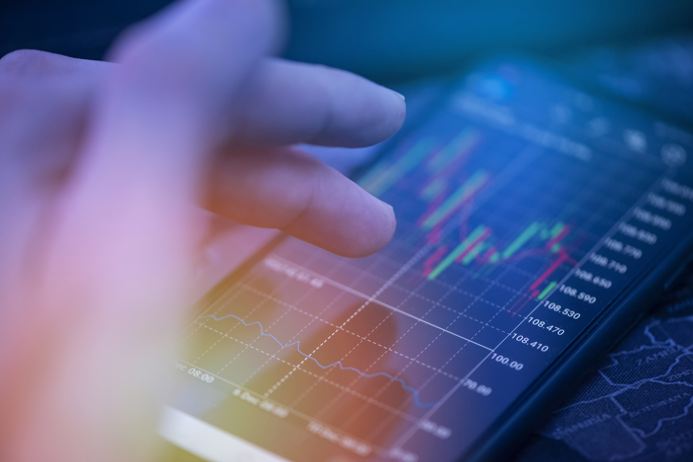 Traders checking stock charts, stock price movements, learning to trade